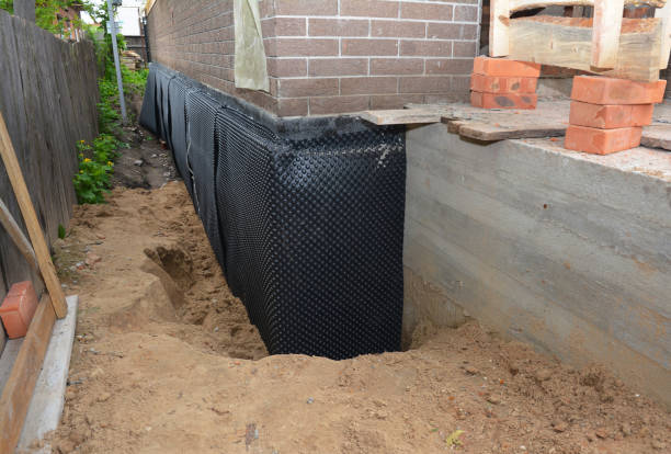 Happy homeowners after waterproofing job in Xenia
